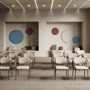 Lifestyle image of white Bejot Hens chairs in rows in a hall with round wall decoration