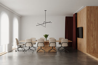 Lifestyle image of Bejot Hens chairs around a long meeting table in a white room