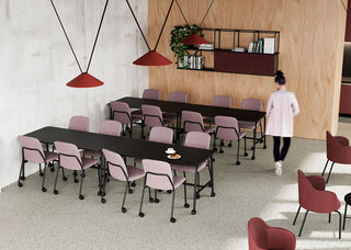 Lifestyle image of pink Bejot Hens chairs at long tables in a canteen with red pendant lamps