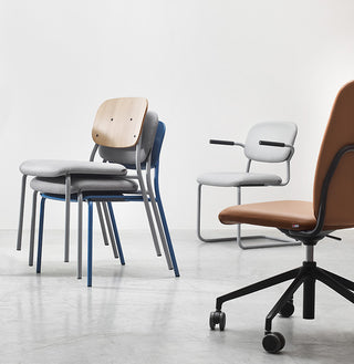 Stacked Bejot Hens chairs next to a Hens swivel chair