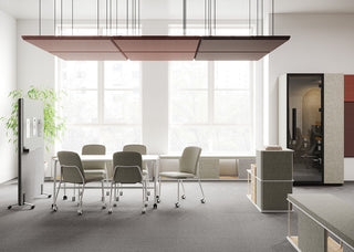 Lifestyle image of white Bejot Hens chairs around a meeting table under an acoustic panel