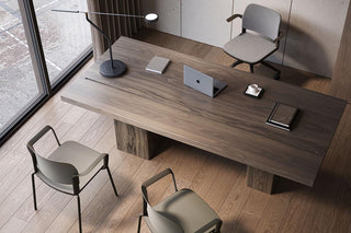 Lifestyle image of grey Bejot Volo chairs at a wooden table, top view