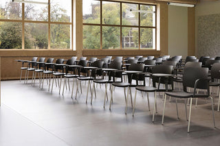 Lifestyle image of black Bejot Volo chairs in rows in a hall with large windows