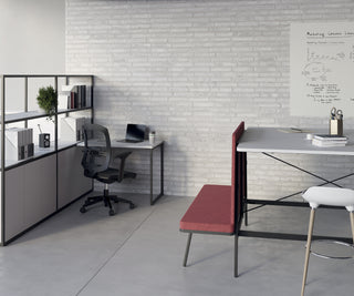 Lifestyle image of a Buronomic Alto bookcase in black and white next to a desk and red bench