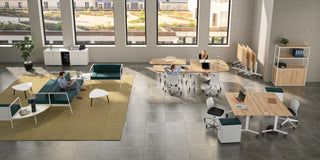 Lifestyle image of a Buronomic Alto three-door bookcase in white and Nebraska in an open loft