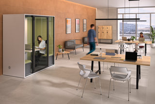 Lifestyle image of a Buronomic Locker Eko six-compartment locker in black and Nebraska by a phone booth