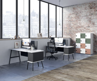 Lifestyle image of a Buronomic Locker Eko 12-compartment locker in white, green, peach and sage in a loft