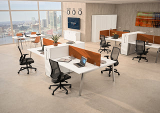 Lifestyle image of white Buronomic Optimax EVO towers by workstations with orange screens and city view