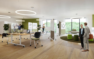 Lifestyle image of an open-plan office with workshop tables and König + Neurath NOOK chairs