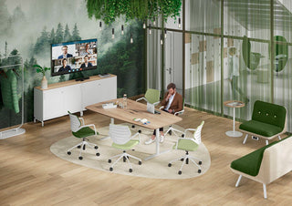 Lifestyle image of a boat-shaped table with green König + Neurath NOOK chairs and jungle wallpaper